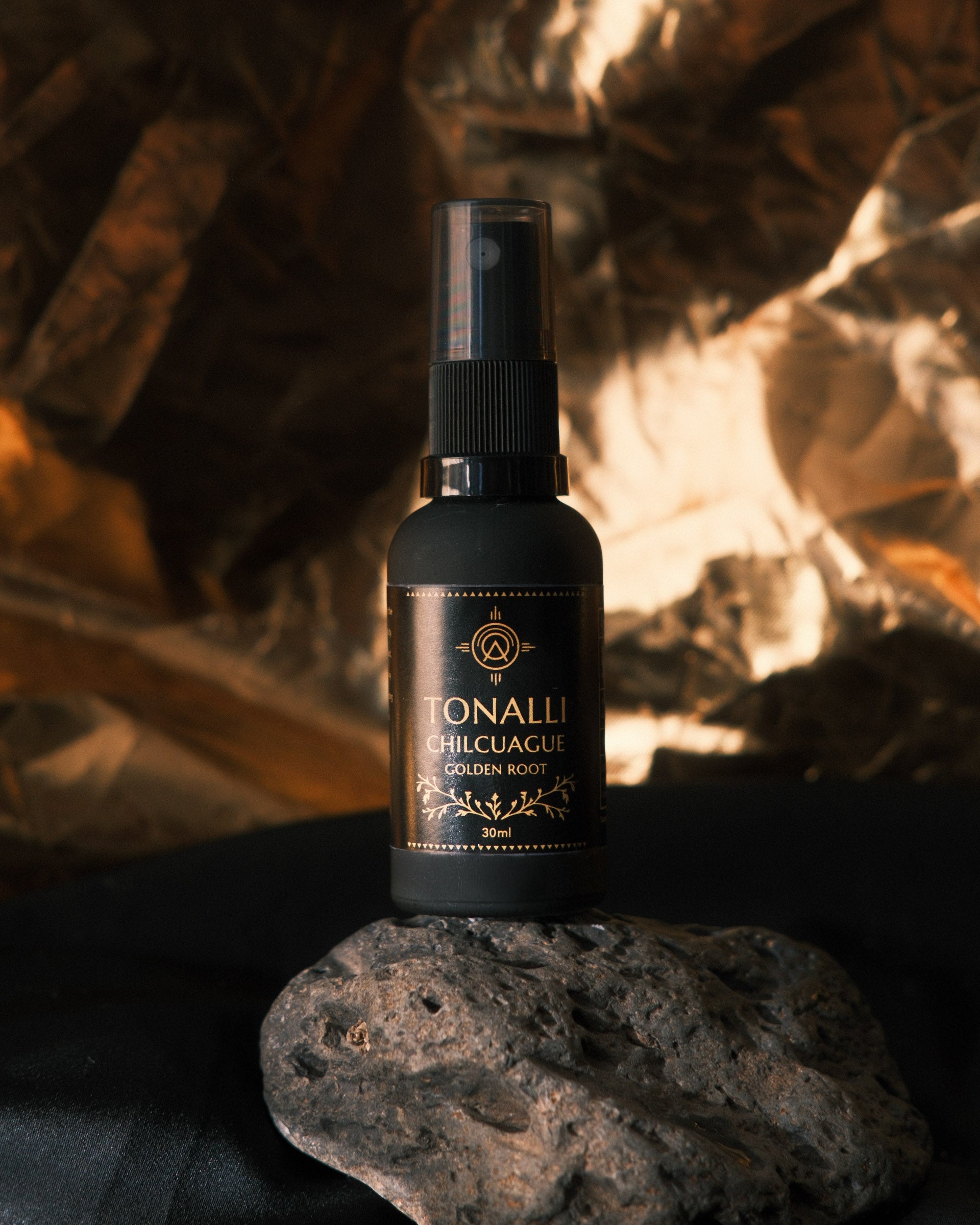 Tonalli Chilcuague oral spray photographed on a dark backdrop