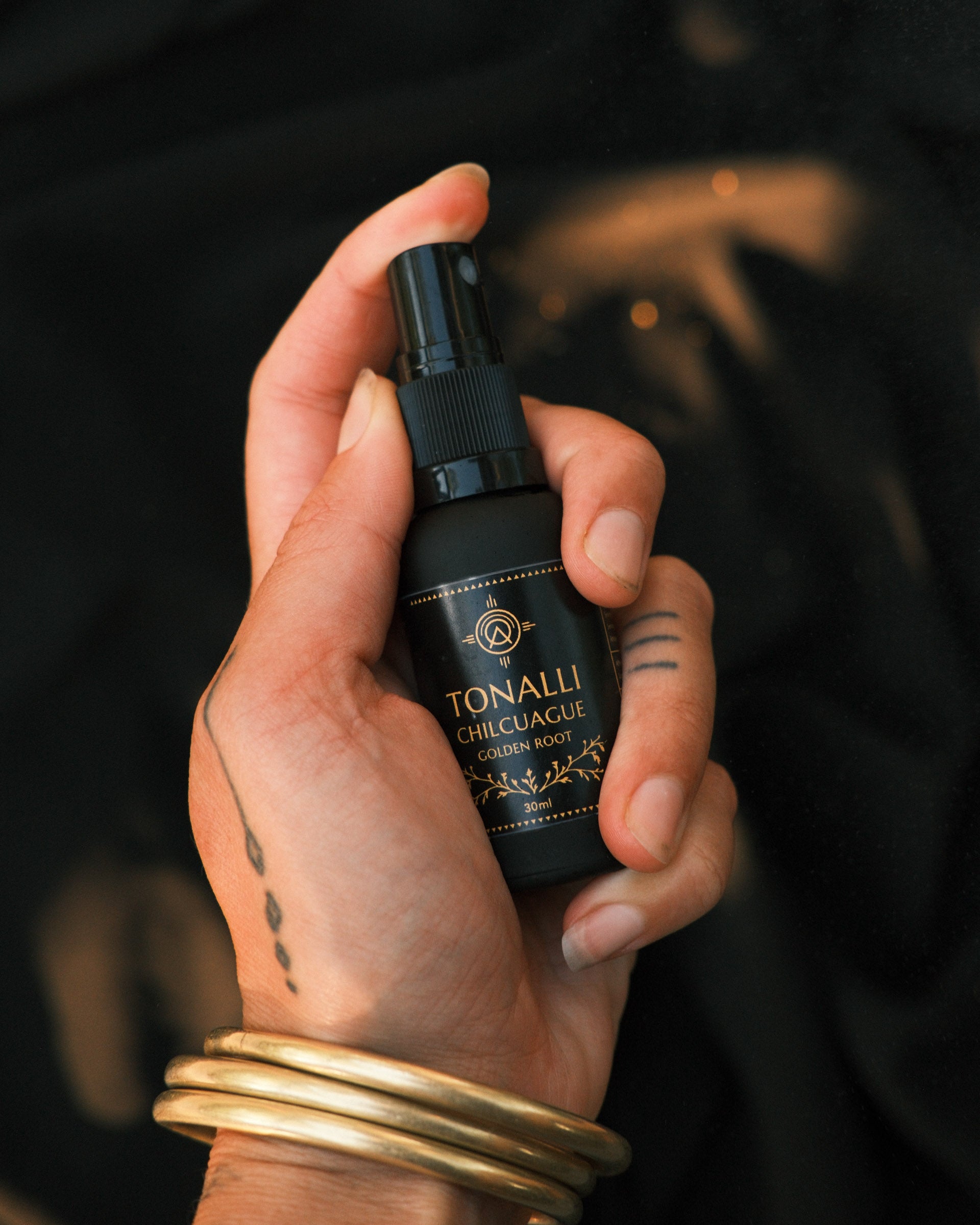 Tonalli Chilcuague oral spray held in hand